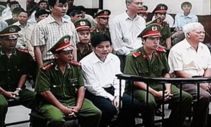 Two Vietnamese newspaper journalists go on trial for exposing state corruption
