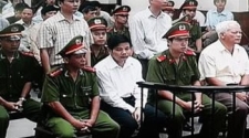 Two Vietnamese newspaper journalists go on trial for exposing state corruption