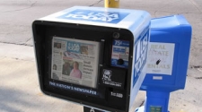 Gannett asks its employees to take a week off without pay, freezes wages for one year