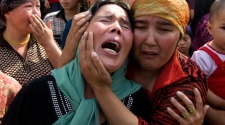China sets prison terms for 3 Uighur Web managers