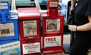 US economic crisis catches up with newspapers, online ad revenues down