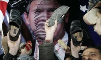 Iraqi journalist who threw shoes at President George W Bush faces trial on February 19