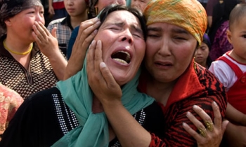 China sets prison terms for 3 Uighur Web managers